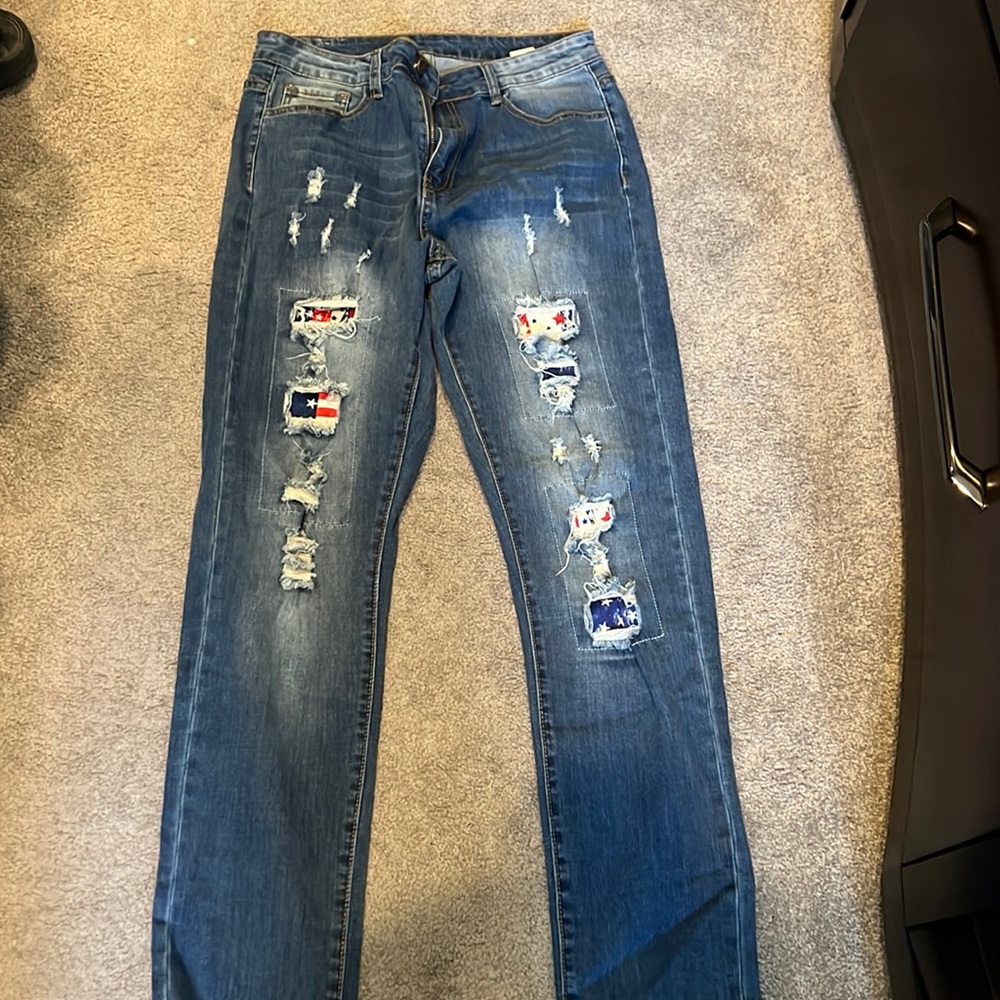 Red white and blue jeans distressed size large fits between 10-12. 31” inseam.
